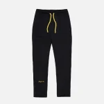 Syna World Trousers: Yellow Logo – Blackk. An attractive product – get new items at an affordable price. At Syna World.