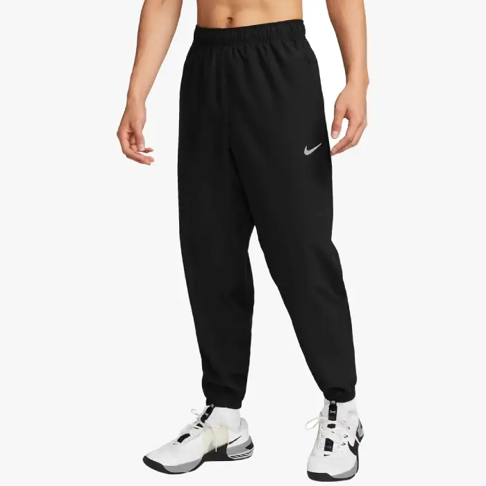 Buy the Syna World x Nike Challenger black trousers from the official Syna World shop. Fast delivery worldwide with easy returns.