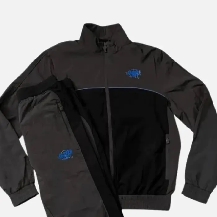 Discover the Syna Logo Shell Black Tracksuitat Syna Worlds. We manufacture this unique design using high-quality materials.