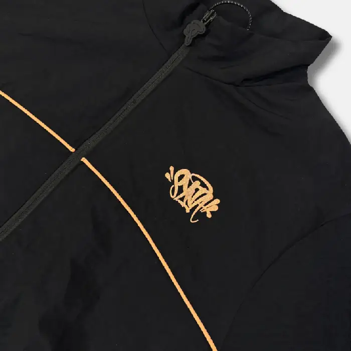 Get the Syna x CRG Black Shell Tracksuit at an affordable price – a unique, high-quality design available at Syna Worlds. Hurry!