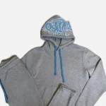 Get the Syna Logo Grey/Blue Tracksuit at an affordable price – a unique, high-quality design available at Syna Worlds. Hurry!